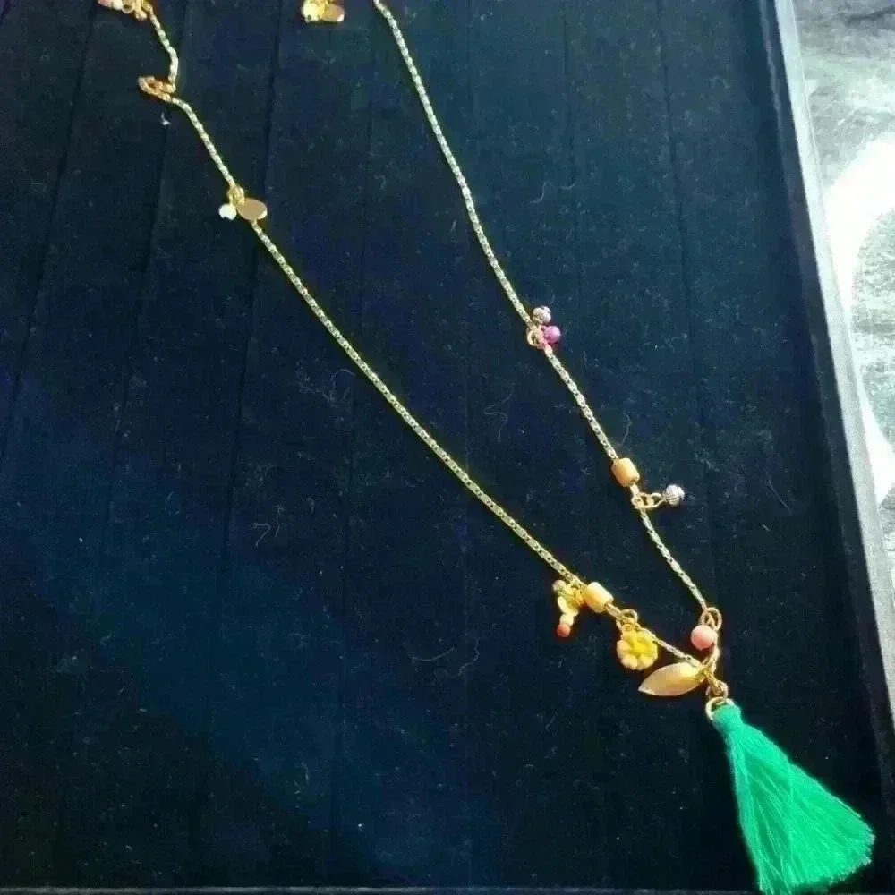 Plunder long gold tone and tassel with beads necklace